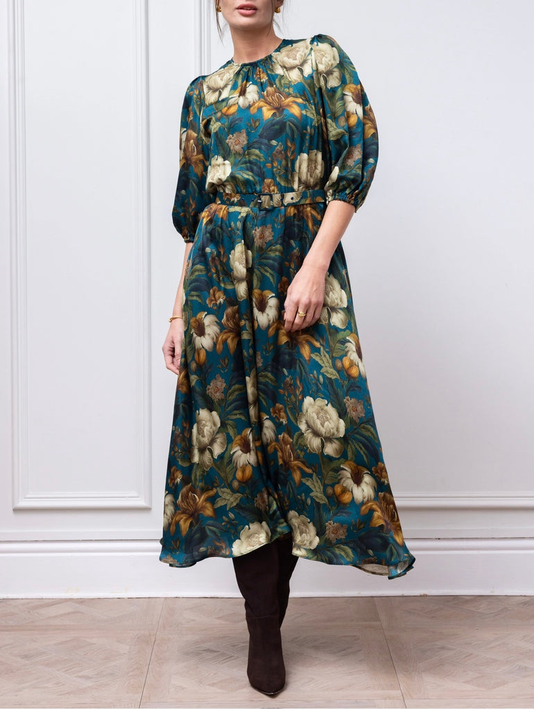 Eira dress in teal floral, angled view showing the full skirt