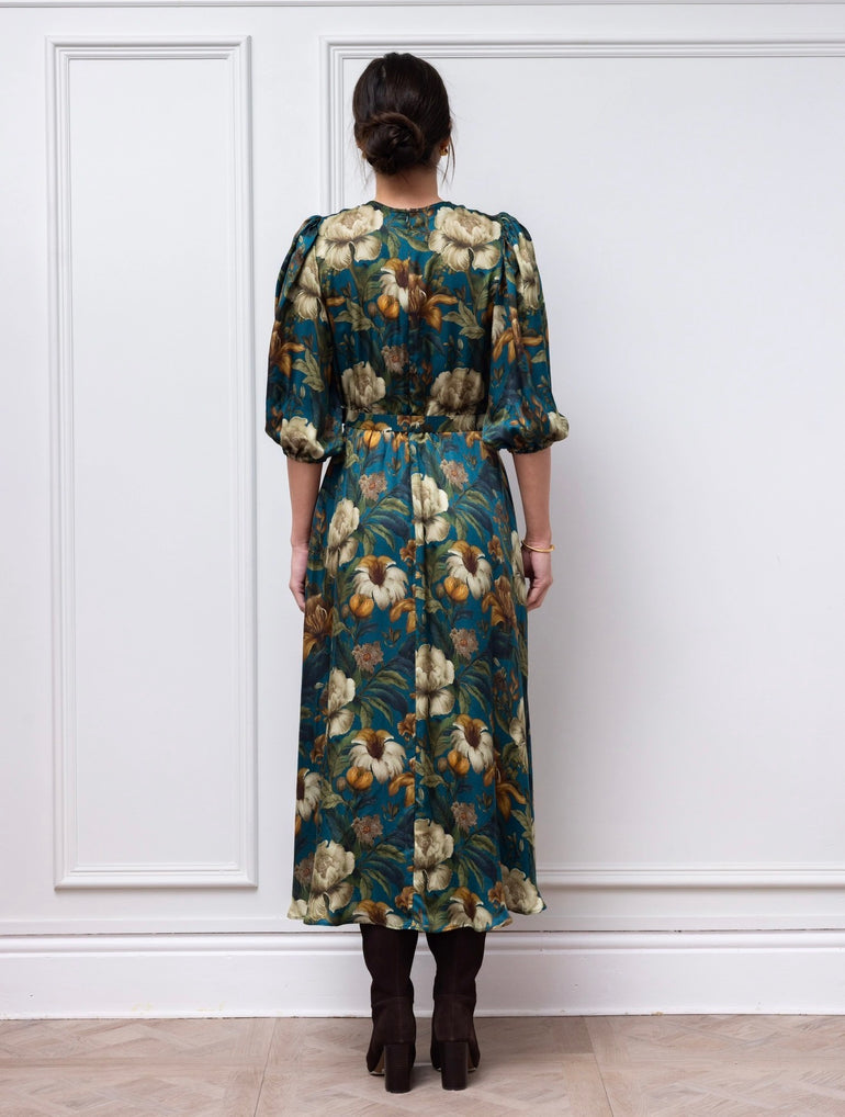 Back view of the Claire Mischevani Eira dress in teal floral with matching belt