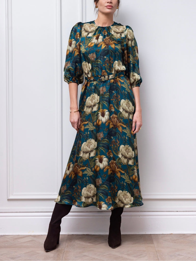 Eira teal floral dress with matching belt, styled with dark boots